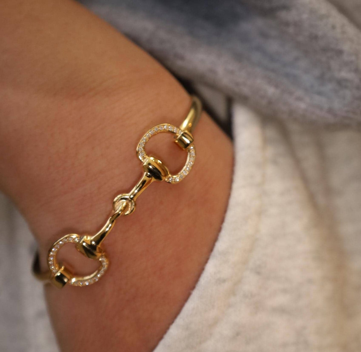 18 ct gold vermeil horsebit bracelet with diamonds close up on wrist