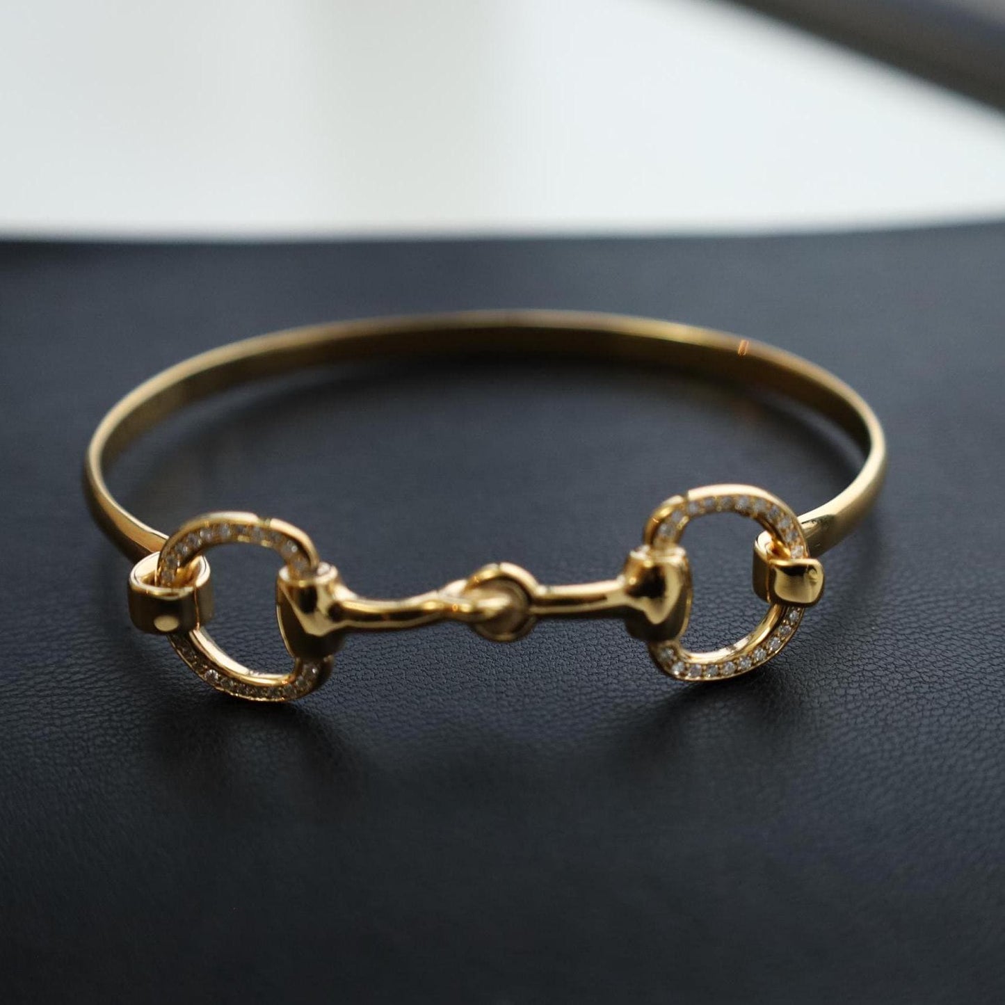 18 ct gold vermeil horsebit bracelet with diamonds with black base