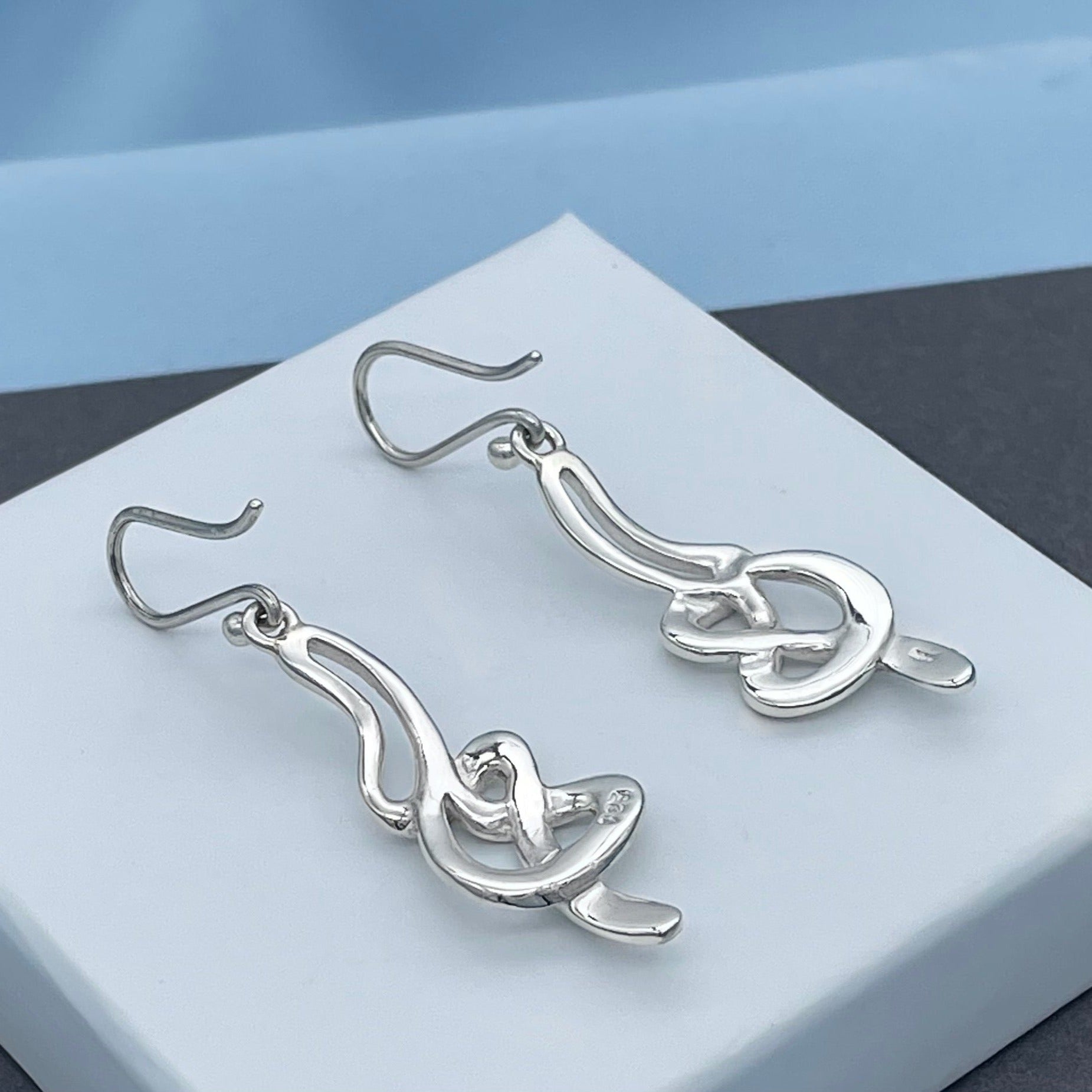 Silver celtic serpent on sale earrings