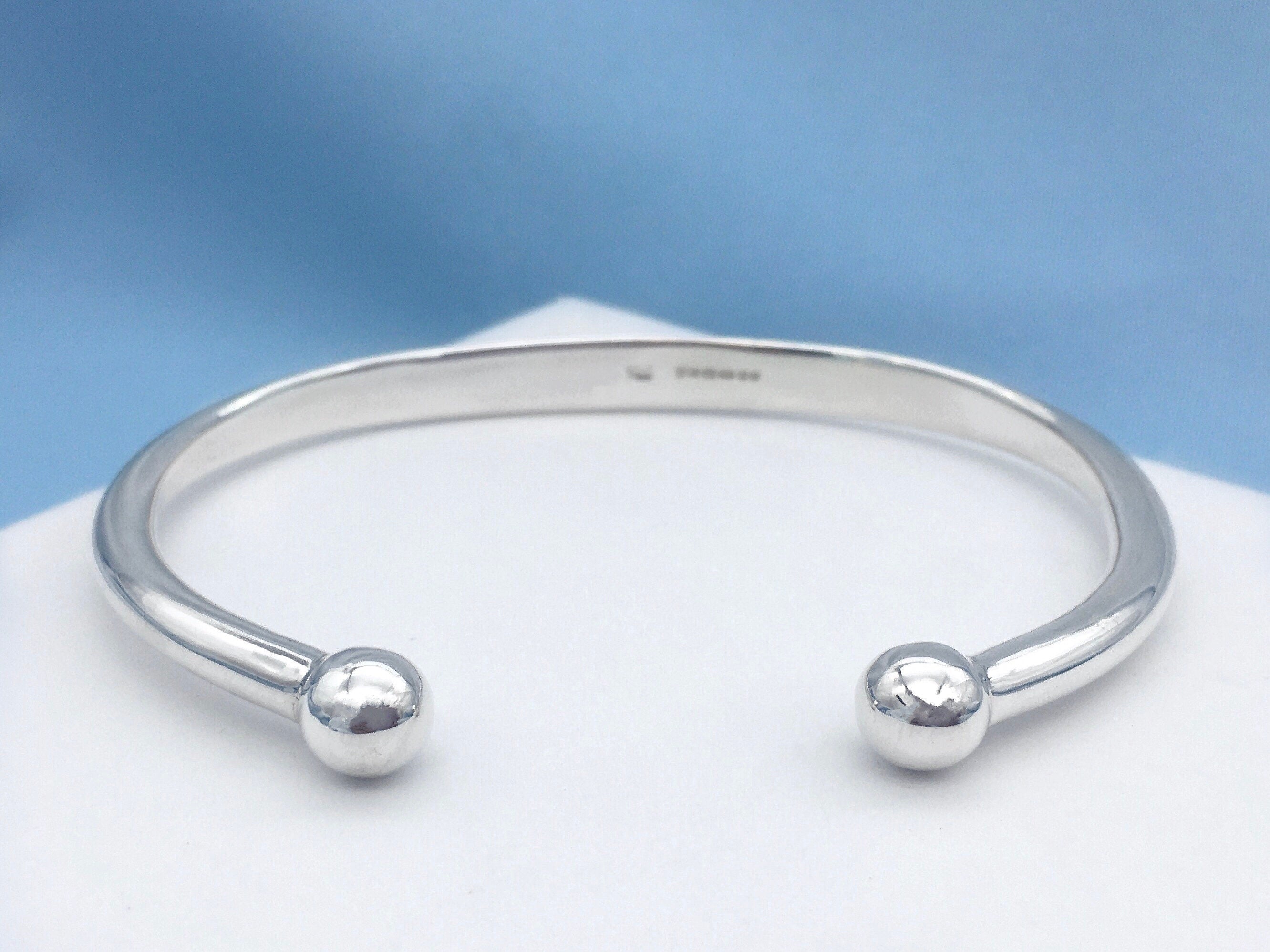 Silver cuff bracelet store with ball ends