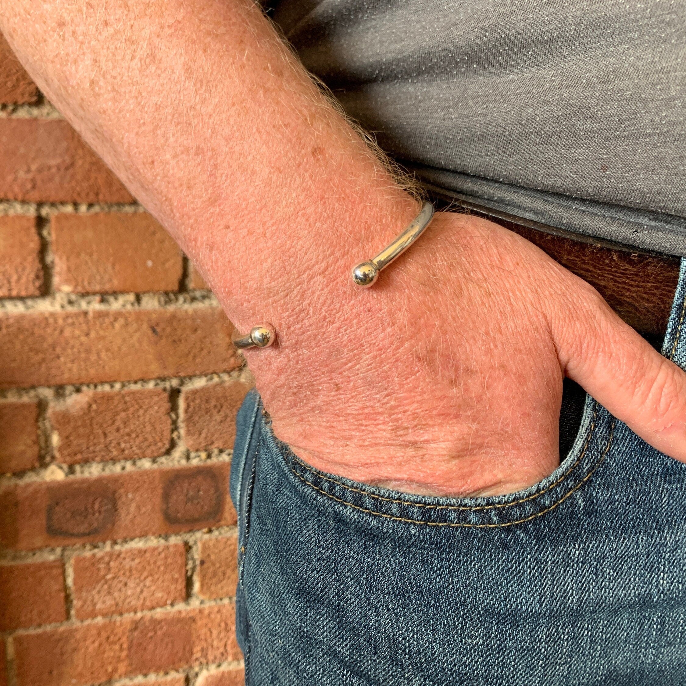 Sterling silver cuff store bracelet with ball ends